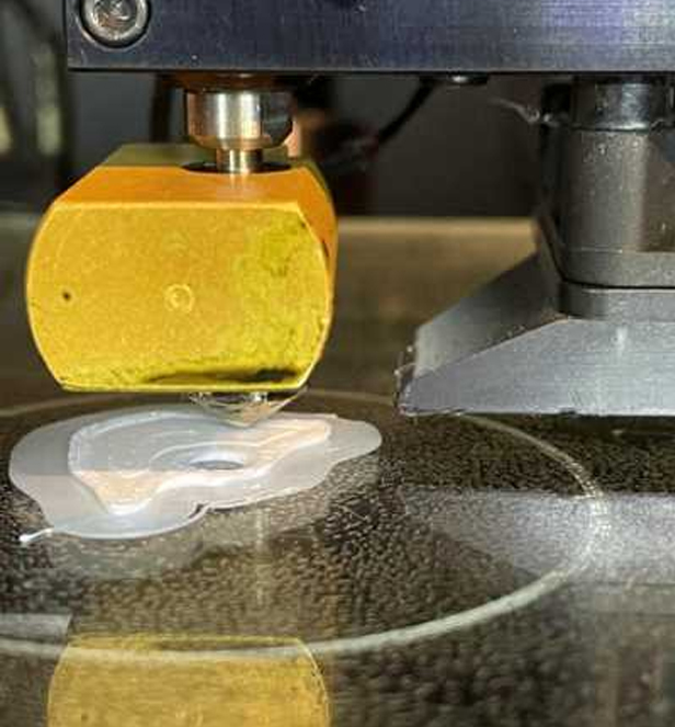 3D printer extruding filament to make a CARL ear mold