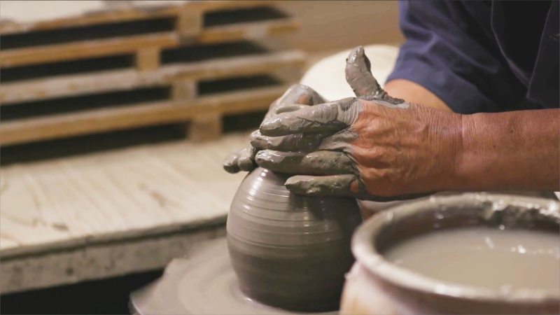 An artist creating a handmade porcelain mold.