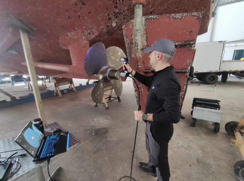 3D scanning allows inspectors to examine propellers almost anywhere. Here, a TrueProp technician scans a propeller while the ship is in drydock.
